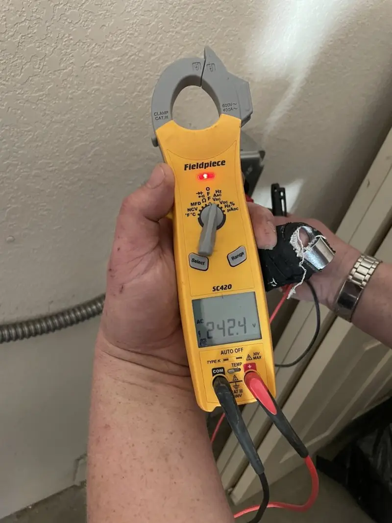 Voltage testing with clamp meter during Electrical Installation Services in Girard